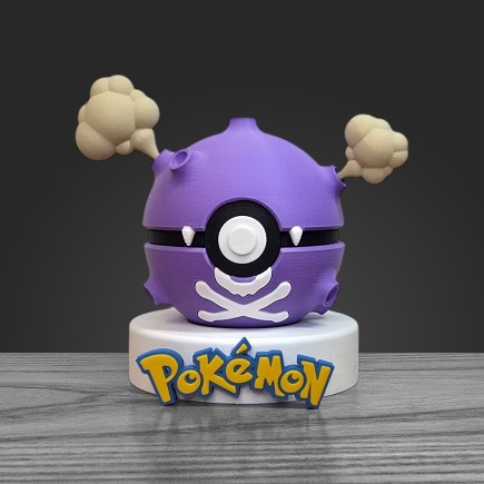 Pokéball Smogo face : corps violet, symbole crâne blanc et cratères de gaz.
