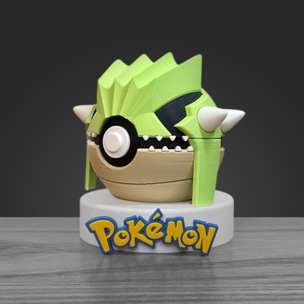Profil gauche Pokéball Groudon chromatique montrant les plaques de lave et la précision de l'impression 3D.
